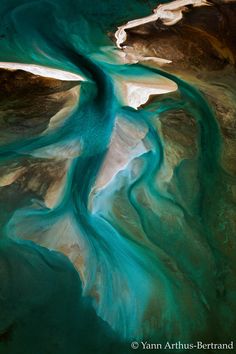 the water is blue and green in this aerial view from space, looking down on it