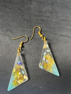 These are handmade resin dangle earrings in Blue & Gold!  Gold Ear-wires & clear backs. Comes in a Gift Box.  Handmade in British Columbia. Clear Resin Earrings With Pressed Flowers, Clear Resin Jewelry With Ear Wire, Handmade Clear Resin Earrings, Handmade Clear Drop Earrings, Hypoallergenic Clear Resin Earrings, Clear Hypoallergenic Resin Earrings, Clear Resin Earrings, Diy Resin Projects, Box Handmade