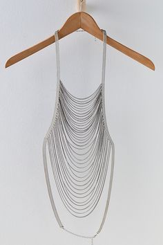 Totally transform your look with this head-turning body chain, featured in a draped chain style that is sure to make a statement. **Features:** Thick metal chain armholes, adjustable neck clasp closure, chain fringe draped across chest, adjustable mid-back clasp closure**Why We <3 It:** Layer this super cool body chain with a basic tee for an upgraded take on the layered necklace look. Free People Necklace, Black Chain Necklace, Chain Fringe, I Love Your, Mama Style, Belly Chain, Black Chain, Anklet Jewelry, Beaded Choker