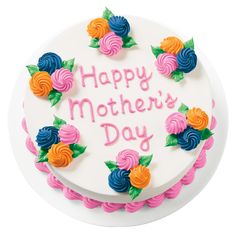 a birthday cake decorated with flowers and the words happy mother's day