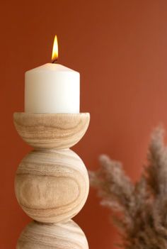 Give these neutral candle holders a roll. These holders, which look like stacked wooden balls, are the perfect neutral touch for your table, mantle, or bookshelf. They suit any style of decor and make a great gift. *Candles not included Large: 5.5"d x 16.5"t Small: 5.5"d x 12.5"t Hand Carved Candles, Ball Candles, Beautiful Candle, Candle Carving, Wood Candle, Wood Product, Wood Candle Holders, Led Candle, Wood Candles