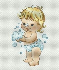 a cross stitch baby in diapers playing with bubbles