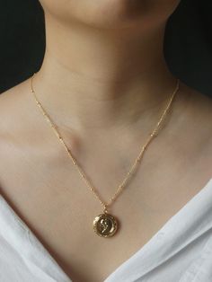 A vintage-inspired locket necklace with a fully functional locket to store little pictures of those close to your heart.

Gold base colour
14k Gold plating

Measurements. Length 52cm + 5cm extension. Gold Pendant Locket Necklace With Delicate Chain, Dainty Flower Pendant Necklace With Vintage Charm, Dainty Rose Gold Pendant Locket Necklace, Gold Locket Necklace In Brass, Gold Brass Locket Necklace, Dainty Brass Locket Charm Necklace, Dainty Gold-plated Locket Necklace, Gold Dainty Brass Locket Necklace, Dainty Gold Brass Locket Necklace