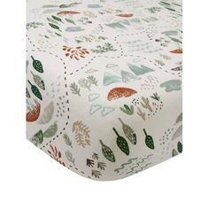 a white sheet with green and red leaves on the bottom, along with an orange leaf design