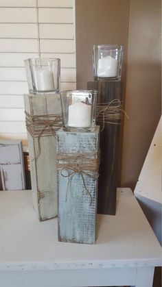 two candles are wrapped in twine and tied with string, sitting on a table