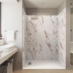 a modern bathroom with marbled walls and floor, along with two sinks on either side of the walk in shower