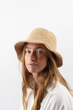 The perfect, minimal vegan bucket hat that will surely become a staple in your wardrobe. Made by hand from naturally-dyed, cabuya plant fiber. A cute, packable hat made by hand and in small batches by our talented women artisan group, this will be your new favorite companion for sunshine-soaked days. Plant Dyed & Crocheted Natural Fiber Moveable 3-4" brim Flexible elastic inner band for the best fit Crocheted Bucket Hat, Packable Hat, Garden Clogs, Crochet Bucket, Crochet Bucket Hat, Knit Outerwear, Black Crane, Plant Dyes, Plant Fibres