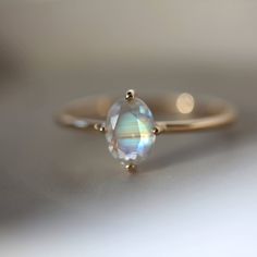 Oval Cut Moonstone Ring, 14k Rose Gold Ring, Rainbow Moonstone Promise Ring  Moonstone Engagement Ring  June Birthstone Ring Moonstone Ring Maine Stone - Natural Moonstone  Stone Shape - Oval Stone Color - Blue Fire  Stone Size - 7x6 MM Birthstone - June Features: * Handmade * Ready To Ship * Center Stone Pearl * Brand New * All Ring Sizes Available * Suitable For Every Day * 14k Solid Gold / 18k Solid Gold / Gold Filled Over Sterling Silver * Purity Stamped * Fits True to Size * High Quality * Engagement Ring Oval Cut, June Birthstone Ring, Ring Moonstone, Manifesting Abundance, Moonstone Engagement, Moonstone Engagement Ring, Moonstone Stone, Etsy Gold Ring, 14k Rose Gold Ring