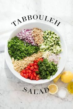 the ingredients for tabbouleh salad in a white bowl on a marble surface