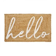 a door mat with the word hello written in white ink on it and an image of a