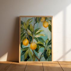 an oil painting of lemons on a tree branch with green leaves against a white wall