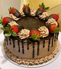 a chocolate cake with strawberries on top