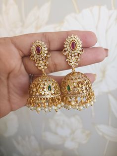 Elevate your special day with these antique earrings by funcre8tions. Featuring beautiful patterns , it’s a fresh take on classic antique jewelry. The antique gold-tone finish and high quality stones perfectly complements these drop earrings. Whatever the occasion, it will add traditional edge to timeless styling. Details & Specifications: Materials used: Brass Alloy with Antique Plating Length - 2.5 inches Brass Jhumkas With Intricate Design For Wedding, Brass Chandbalis For Wedding, Wedding Jhumkas With Intricate Brass Design, Wedding Brass Jhumkas With Intricate Design, Ornate Brass Bridal Earrings For Festive Occasions, Brass Bridal Earrings With Latkans For Wedding, Bridal Brass Earrings With Latkans For Wedding, Wedding Bridal Earrings With Latkans In Brass, Bollywood Brass Jhumkas With Intricate Design