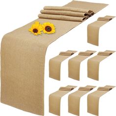 a table runner with sunflowers on it and six place mats for each runner