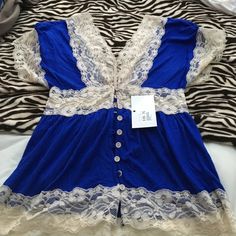 NWT Royal Blue and Ivory lace top Royal Blue top with Ivory lace trim and front button down closure. Tops Tunics Ivory Lace Top, Royal Blue Top, Blue Top, Ivory Lace, Lace Tops, Tunics, Lace Trim, Royal Blue, Lace Top