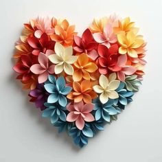 paper flowers arranged in the shape of a heart