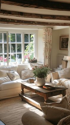 a living room filled with lots of white furniture