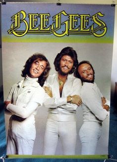 an advertisement for bee gees on the wall