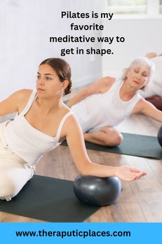 two women are doing yoga on the floor with an exercise ball in front of them