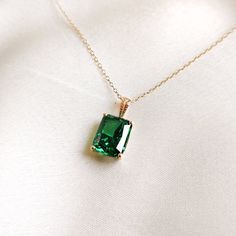 This stunning pendant is set in 14K Solid Yellow Gold with AAA Green Cubic Zirconia in classic prong setting. It is an unique gemstone pendant for nearly every occasion and is completely hassle-free jewelry. ◾ITEM DETAILS * Gem: Cubic Zirconia Green * Gem Size: 8X10mm * Gem Shape: Octagon cut * Gem Weight: 7.01 carats * Gold Purity: 14KT  * Gold Weight: 0.67 gram * Total Weight of the Pendant: 2.07 gram The Gold purity is guaranteed and it comes with authentic 14KT gold hallmark. Since my items Classic Rose Gold Emerald Jewelry, Brilliant Cut May Birthstone Necklace Gift, May Birthstone Necklace With Brilliant Cut Gift, Classic Cubic Zirconia Emerald Necklace, Gift Cubic Zirconia Emerald Necklace, Dazzling Gold Emerald Necklace As Gift, Dazzling Gold Emerald Necklace Gift, Green Brilliant Cut Necklace For Gift, Dazzling Emerald Necklace With Gemstones As A Gift