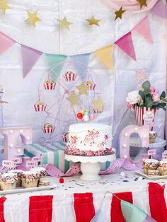 a carnival themed birthday party with cupcakes and cake