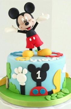 a mickey mouse birthday cake with the number one on it