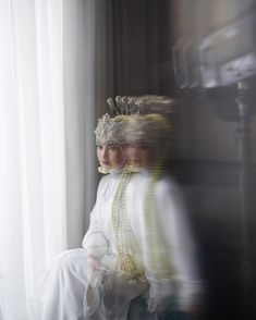 a blurry photo of a woman wearing a crown