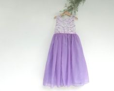 Purple Tulle Bridesmaid Dress, Bridesmaid Princess Dress With Lace Bodice, Spring Lavender Tulle Dress, Sleeveless Bridesmaid Princess Dress With Lace Trim, Elegant Purple Princess Dress For Spring, Lace Princess Dress With Fitted Bodice For Bridesmaids, Spring Princess Dress With Fitted Bodice For Bridesmaid, Spring Confirmation Dress With Lace Bodice, Lavender Tulle Bridesmaid Dress