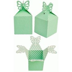 three green boxes with bows on them