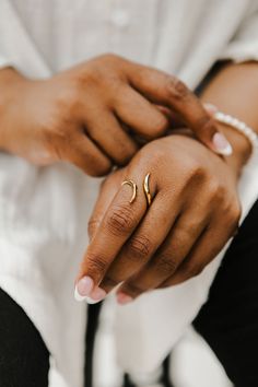 Asymmetry is in, and this 18k yellow gold plated ring is open. The unconventional and stunning silhouette of this ring is a great compliment to your collection. Product Detail 18k gold Plating Stainless Steel Size: Adjustable Opening Nickel and lead free Jewelry photos are enlarged to show detail. Packaging Every Ose purchase will arrive in a box . In that box our pieces are placed in our microfiber pouches or white jewelry boxes. All boxes and pouches are designed to be reused for travel and st Gold Minimalist Adjustable Bypass Ring, Gold Plated Open Ring Jewelry, Gold Open Ring With A Modern Twist, Gold Midi Rings For Promise With Modern Twist, Modern Gold Plated Midi Rings For Anniversary, Modern Twist Gold Open Ring Jewelry, Dainty Gold Bypass Ring, Modern Twist Open Gold Ring, Modern Gold Toe Ring