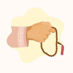 a hand holding a rosary with a red tassel