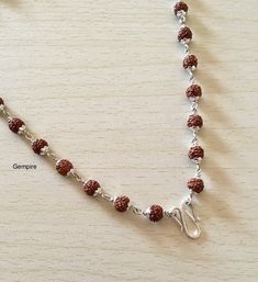 "Sterling Silver Rudraksha Necklace. This beaded necklace can be worn by men as well as women. This Mala can be worn in multiple ways, it can be worn as it is, or you can attach a pendant/tassel in the lock of this Mala to wear it as a pendant necklace. About Rudraksha:-- Rudraksha have been traditionally used as prayer beads. They are associated with Lord Shiva and the name Rudraksha translates to the Shiva's tears. They commonly worn by his devotees. They are worn as a form of protection as th Temple Jewelry Necklaces With 8mm Beads For Festivals, Spiritual Necklaces For Puja With Polished Beads, Spiritual Silver Beads Necklaces For Festivals, Spiritual Silver Beaded Necklace, Spiritual Tiny Beads Jewelry For Festivals, Spiritual Silver Beaded Necklaces For Festivals, Spiritual Polished Beads Necklace For Puja, Spiritual Necklaces With Silver Beads For Puja, Spiritual Silver Beaded Necklaces For Puja