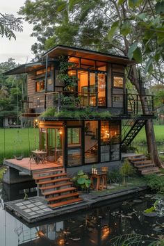 the house is built on stilts and has plants growing out of its windows, while stairs lead up to the second floor