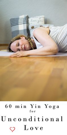 a woman is laying on the floor with her eyes closed and arms behind her head