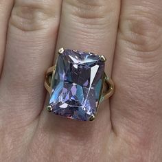 Very large and very beautiful LILAC Ice CZ set in a 14K yellow gold split shank band. The stone is emerald cut, which perfectly shows off the stunning color.  - Size 7 - Emerald cut stone is 17.7 x 13.3mm and equals more than 7 carats - 11g We can resize rings for a fee. Please inquire! Gold Emerald Cut Gemstones For Anniversary, Gold Emerald-cut Gemstones With Accent Stones, Gold Emerald Cut Gemstones With Accent Stones, Ice Ring, Resize Ring, Split Shank, Emerald Cut, Rings Statement, Favorite Jewelry