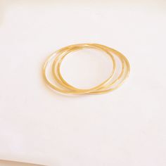 A simple and minimalistic 2mm bangle. Perfectly capable of riding solo or a great piece to pile on with your other favorites. These bangles are forged from sturdy copper, brass or solid sterling silver. Delicate eye catchers! Perfect for everyday. Measure the with of your closed fist from the top center of one knuckle to the other. Select the closest bangle size. Please view the last picture on this listing that shows how to measure for your correct size as there will be a charge for size exchan Minimalist Stackable Hoop Bangle, Minimalist Stackable Round Bangle, Minimalist Hoop Bangle As Gift, Nickel Free Minimalist Round Bangle, Minimalist Nickel-free Round Bangle, Minimalist Everyday Round Bangle, Everyday Minimalist Round Bangle, Minimalist Nickel Free Bangle Bracelets, Nickel-free Minimalist Bracelet Bangle