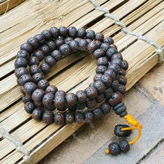 Discover the harmonious blend of spirituality and protection with our stunning Natural Antique 108 Dark Aged Rudraksha Mala Rosary. Handcrafted with love and care, this 108-bead rosary brings together the spiritual essence of Hindu and Buddhist traditions ❤Product Details:  Great Mala For Meditation and Yoga Practitioners  Well Strung on macrame cotton thread   Beads are approximately 8-9mm and Malas is around 32-34 Inches Long ❤ Natural Dark Rudraksha Beads: Each bead is carefully selected for its rich color and natural texture, providing a tactile and visual connection to the Earth's energy Beads are naturally stained and oiled to achieve their beautiful dark color and aged appearance.  ❤Spiritual Significance: The 108 beads in this rosary hold deep spiritual significance, traditionally Spiritual Wooden Beaded Healing Bracelets, Spiritual Brown Beaded Bracelets, Spiritual Beaded Necklace With Spacer Beads For Festivals, Spiritual Beaded Necklaces With Spacer Beads For Festivals, Spiritual Wooden Beads Mala For Festival, Spiritual Wooden Beads For Puja, Meditation Jewelry With Wooden Round Beads, Spiritual Hand-strung Beaded Bracelets For Rituals, Meditation Jewelry With Round Wooden Beads