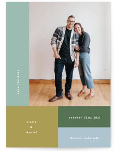 a man and woman standing next to each other in front of a white wall with the words save the date on it