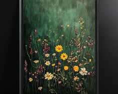 a painting of wildflowers and other flowers on a green background with black frame