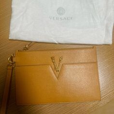 Versace Clutch Bag Like New . Only Wore It Once Color Beige . All The Certificates Included Luxury Pouch With Detachable Strap, Designer Clutch Pouch With Gold-tone Hardware, Versace Bags, Like New, Versace, Clutch Bag, Bag Lady, How To Wear, Color