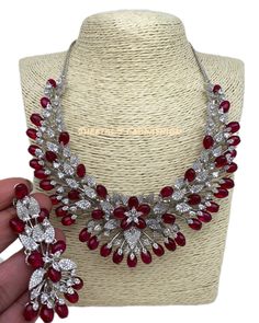 CZ Red Stone Silver Finish Neckline Short Necklace, Cubic Zirconia Necklace Earrings Length : 2.75 Inches Red Traditional Cubic Zirconia Necklaces, Luxury Red Cubic Zirconia Diamond Necklace, Red Diamond-cut Necklace For Anniversary, Red Multi-stone Necklaces As Gifts, Red Multi-stone Cubic Zirconia Jewelry, American Diamond Jewellery, Zirconia Necklace, Cubic Zirconia Necklace, Emerald Bead