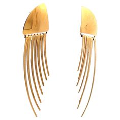 This beautiful pair of 14k yellow gold statement earrings are gorgeous. The earrings feature a dangle design that allows the earrings to be worn in either directions, allowing them to be worn in multiple ways while still delivering a fresh look. Being made in 14k yellow gold, these earrings are durable and go with any outfit. They can also be worn as casual earrings or dressed up with for formal occasions. The curved shape as well as the dangles ensure these earrings are always reflecting light Contemporary Pierced Yellow Gold Earrings, Contemporary Yellow Gold Pierced Earrings, Contemporary Yellow Gold Drop Earrings, Modern Yellow Gold Earrings For Party, Contemporary Gold Earrings For Parties, Contemporary Gold Long-drop Earrings, Modern Yellow Gold Drop Clip-on Earrings, Contemporary Gold Drop Earrings, Contemporary Yellow Gold Evening Earrings