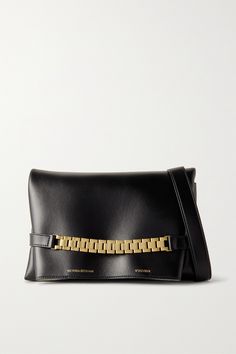 You'll find so many ways to style Victoria Beckham's classic clutch. Made in Italy from the softest leather, it has a neat rectangular profile and comes with a detachable strap, so you can wear it as a shoulder bag. The gold-tone chain draws inspiration from a much-loved vintage watch strap, sourced from the designer's own collection. Timeless Leather Clutch For Everyday Luxury, Victoria Beckham Bags, The Row Bag, Leather Clutch Bags, Fine Jewelry Designers, Leather Pouch, Leather Chain, Leather Clutch, Blue Bags