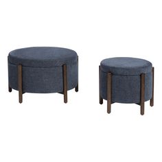 two round stools with wooden legs and blue fabric upholstered seat covers on each side