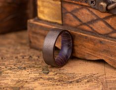 a wooden ring sitting on top of a map