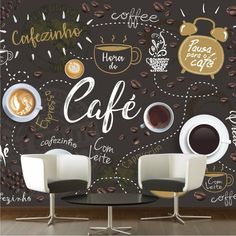 two chairs and a table in front of a wall with coffee related items on it