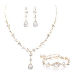 a set of jewelry including necklace, bracelet and earring with white stones on it