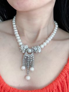 This stunning tassel necklace features beautiful natural freshwater white pearls and sparkling zircon stones, creating an elegant and timeless piece of jewelry. Perfect as a gift for her, this necklace is ideal for special occasions such as Mother's Day or as a bridal accessory. The combination of pearls and zircon stones adds a touch of sophistication and glamour to any outfit, making it a versatile and luxurious addition to any jewelry collection. Elegant Pearl Drop Necklace For Celebration, Elegant White Pearl Necklace For Celebration, Elegant Pearl White Bridal Necklace For Celebration, White Akoya Pearl Necklace For Evening, White Pearl Necklace With Pearl Charm For Evening, Elegant White Crystal Pearl Necklace, Luxury White Pearl Bridal Necklace, Luxury White Bridal Necklace With Pearl Pendant, White Pearl Drop Bridal Necklace For Evening