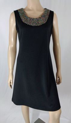 "Women's Dress Sleeveless Excellent Condition Designer by RONNI NICOLE Size 6 Lux Expensive Designer Chic! Black classic sleeveless dress in lux thick RAYON spandex blend fabric, amazing simple unique high taste chic design, scoop neck with colorful heavily beaded neck line, great silhouette. Super high quality. PERFECT GO-TO DRESS. Excellent condition. Easy to wear casual chic vintage for the disco sporting life. MEASUREMENTS: Length - 35.5\" Bust (underarms to underarms) - 38\" Sleeve (shoulde Sleeveless Beaded Formal Dress, Formal Sleeveless Beaded Mini Dress, Formal Beaded Sleeveless Mini Dress, Formal Beaded Sleeveless Dress, Formal Sleeveless Beaded Dress, Black Dress Sleeveless, Beaded Neckline, Designer Vintage, Black Sleeveless Dress