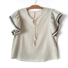 Solitaire Oatmeal Striped Ruffle Sleeve Blouse Top. Short Sleeve With Embroidered Trim. Tassel Tie. 100% Cotton. Brand New With Tag. Please See Details On The Pictures And Feel Free To Ask Any Questions. Beige Cotton Blouse For Brunch, Chic Cream Tops With Ruffle Sleeve, Off White Ruffled Blouse For Brunch, Chic Beige Tops With Flutter Sleeves, Chic Beige Top With Flutter Sleeves, Chic Beige Flutter Sleeve Top, Feminine Cream Ruffle Sleeve Tops, Beige Ruffled Top With Flutter Sleeves, Beige Ruffled Flutter Sleeve Top